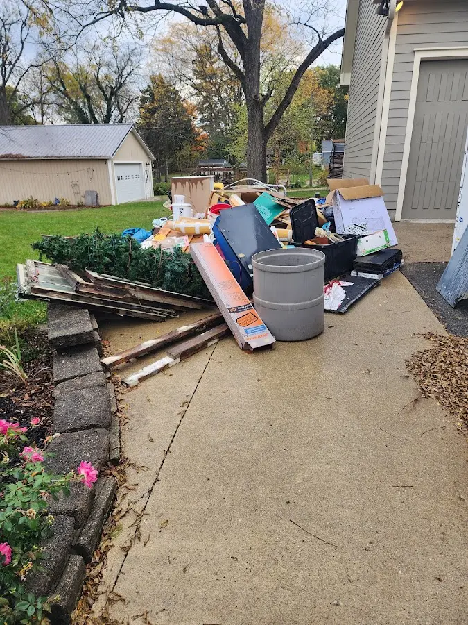 Dumpster being loaded with debris for Residential Dumpster Rental in Camas